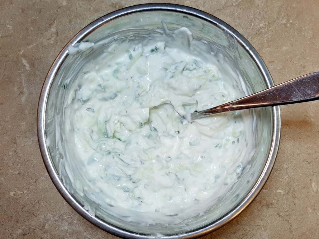 white sauce with spoon in metal bowl