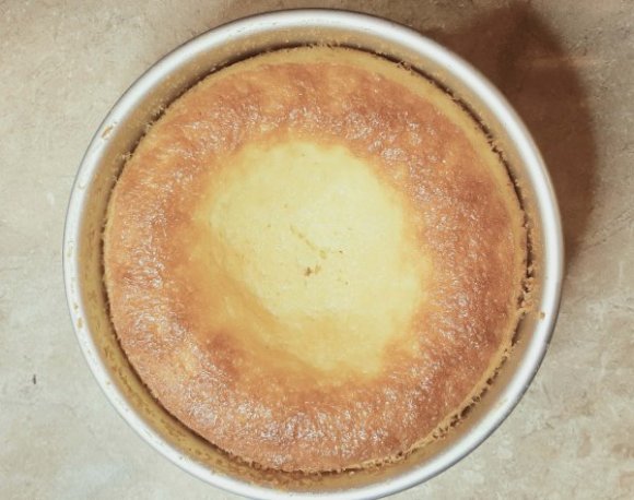 round yellow cake on a counter