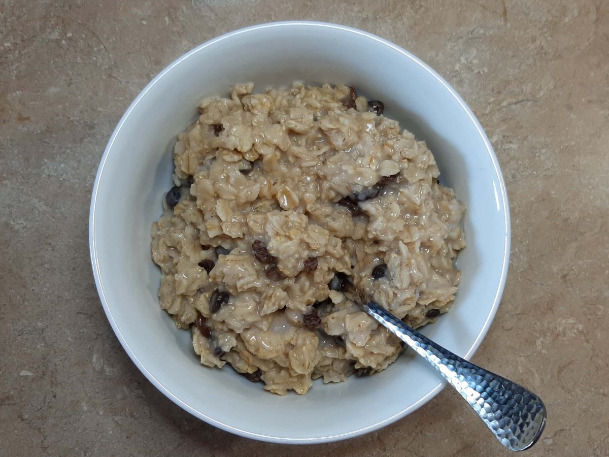 oatmeal with raisins in white bowl