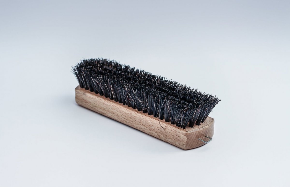 black steel brush for the best way to clean a chicken coop